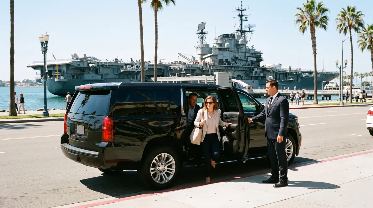 Black SUV dropping off visitors on North Harbor Drive near the USS Midway Museum